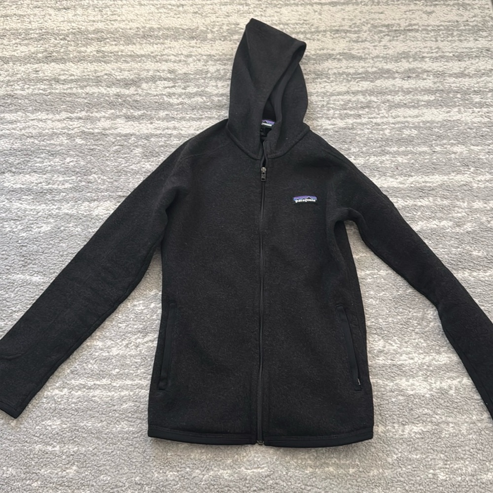 Patagonia hooded better sweater fleece. Very soft and comfortable.